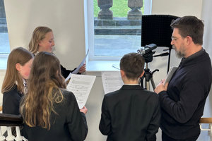 education consultant, Douglas and pupils recording a script